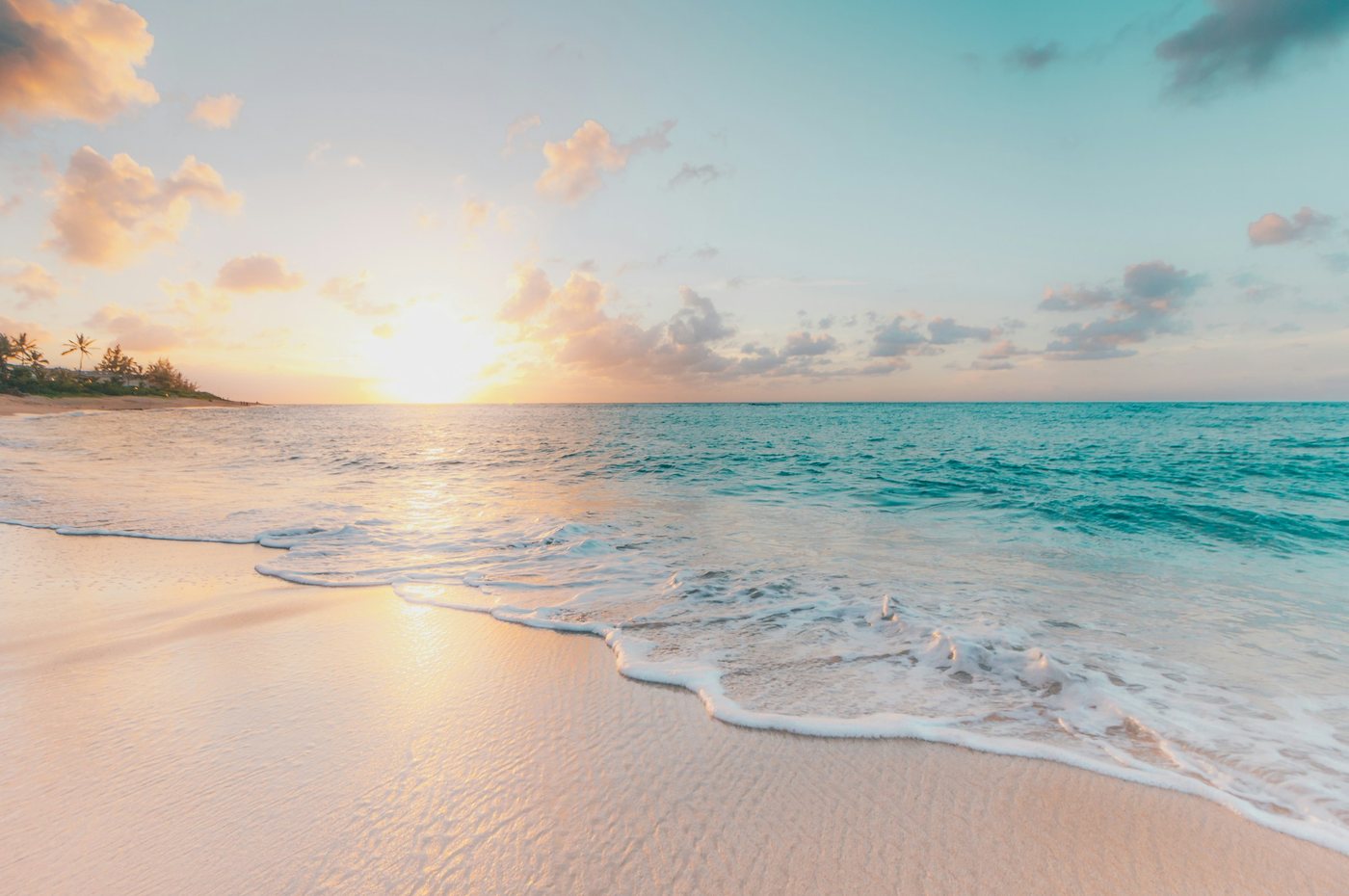 Turquoise water meeting pale sand